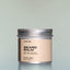 A container of Temple Smoke Beard Balm against a grey background.
