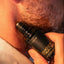 Close-up of stubbled lower face with Beardbrand Ghost Tracer Eau de Parfum roll-on bottle held against the skin.