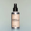 A bottle of Tree Ranger Utility Deodorant with a spray dispenser against a grey background.